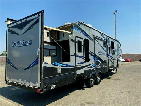 2016 KEYSTONE FUZION 345 FIFTH WHEEL TOY HAULER TRAILER RV 3 SLIDES
