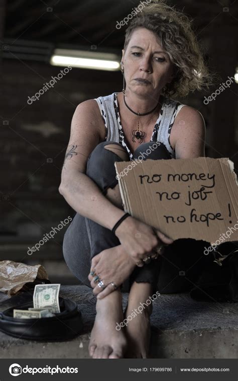 homeless woman with sign