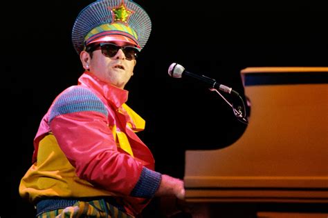 Photos Of Iconic Elton John Performances And Fashion Over 50 Years