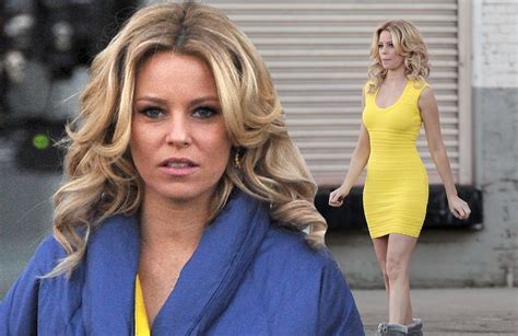 Elizabeth Banks Shows Off Her Slender Figure In A Yellow Bodycon Dress Before Wrapping Up In A