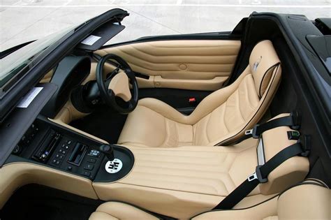 The Interior Of A Sports Car Is Clean And Ready To Be Driven