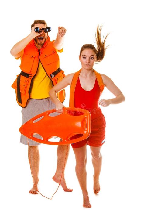 Lifeguards In Life Vest With Rescue Buoy Running Stock Image Image Of