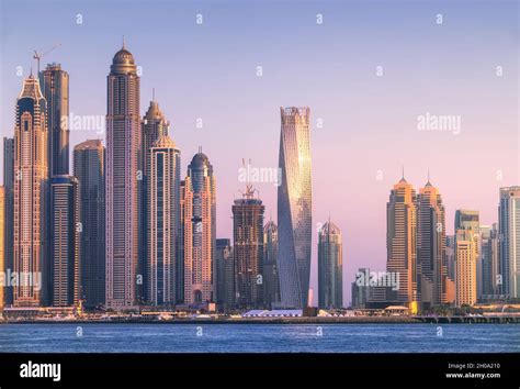 Modern Buildings With Gold Reflection Of Sunset On Dubai Marina Bay