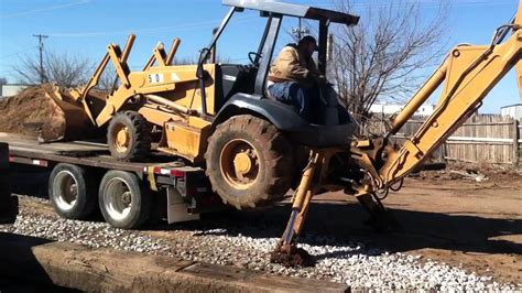 How To Load A Backhoe On A Trailer Without Ramps Youtube