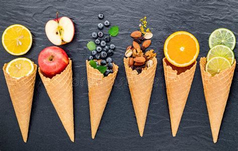 Various Of Ingredient For Ice Cream Flavor In Cones Set Up On Dark