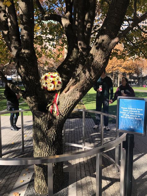 Flowers Were Placed At The Survivor Tree On The 911memorial In Honor Of