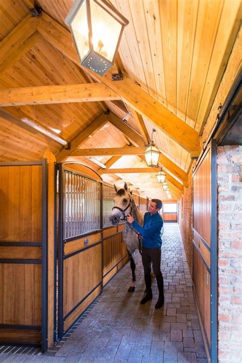 15,380 horse barn premium high res photos. beautiful barn aisle | Stables, Equestrian barns, Horse barns