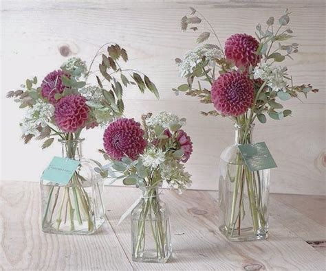 White mini pumpkins in glass tube wedding. The Flower Buds | Small flower arrangements, Small vases ...