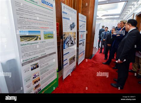Secretary Kerry And Chinese State Councilor Yang Look At A Display About Environmental Products