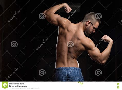 Muscular Geek Man Flexing Muscles In Gym Stock Photo Image Of Body