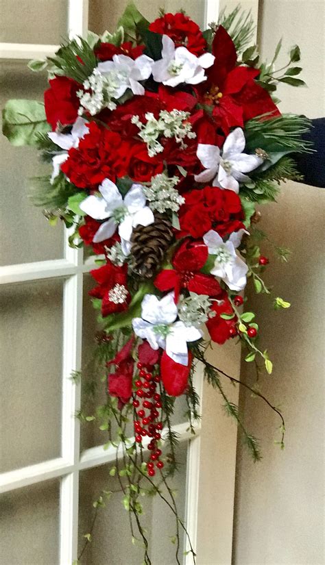 aiyanna s bouquet with her velvet white poinsettias christmas wedding flowers red bouquet