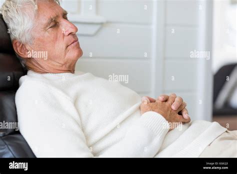 Senior Man Sleeping On Chair Stock Photo Alamy