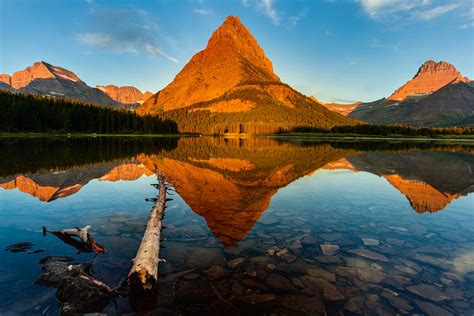 Sunrise At Swiftcurrent Lake In Glacier National Park Photograph By