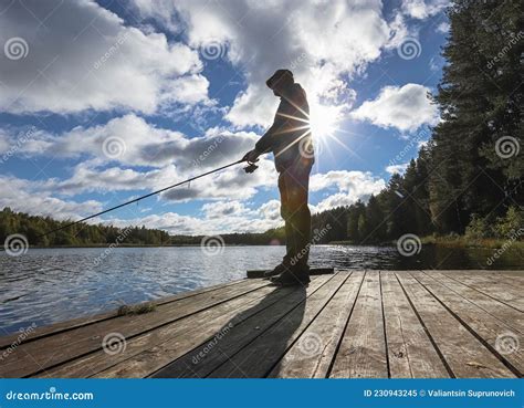 Fisherman Fishing Alone With Rod And Sun Stock Image Image Of Male