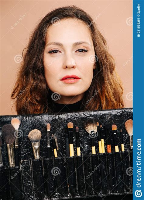 middle aged woman presenting her set of cosmetic brushes stock image image of girl pretty