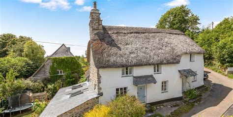 Dating back to 1810 with a wealth of character this charming village home has many stories to tell! Grade II Listed Thatched Cottage For Sale Totnes, Devon