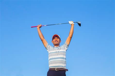 Premium Photo Man Swinging Golf Club With Blue Sky