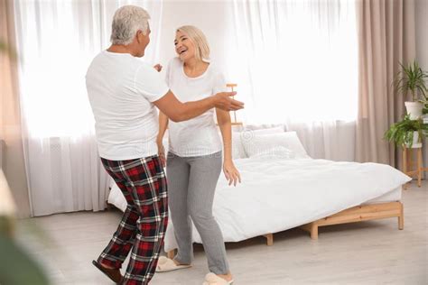 Happy Mature Couple Dancing In Bedroom Stock Image Image Of Love