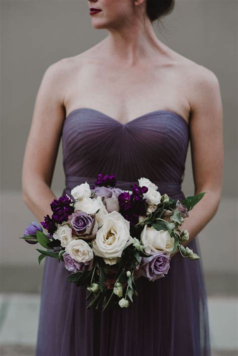 Bridesmaid In Dusty Lavender Dress Holding A Plum White And Lavender Bo