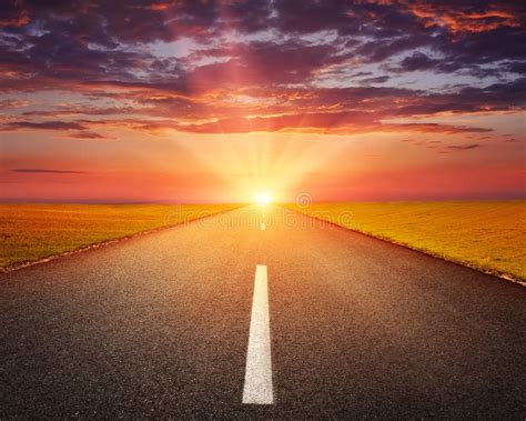 Driving On An Empty Asphalt Road At Sunset Stock Photo Image Of Grass