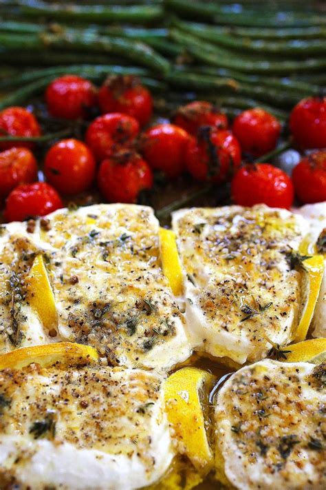 Halibut fillet with green beans and cherry tomatoes baked in a delicious mediterranean sauce with garlic, olive oil and lemon juice. One-pan Baked Halibut with Vegetables - Guss Cooks