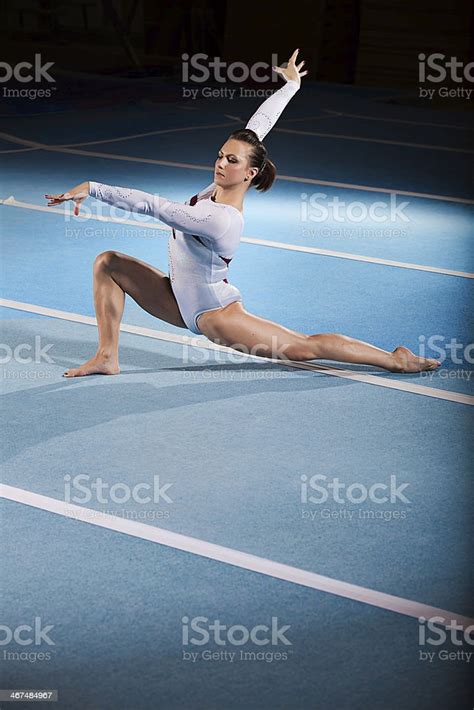 Portrait Of A Young Gymnast Competing At The Stadium Stock Photo
