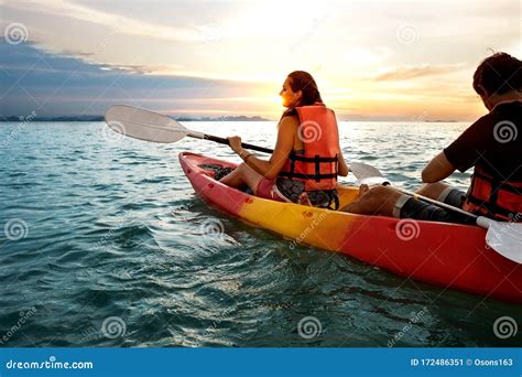 Couple Kayaking Together Beautiful Young Couple Kayaking On Lake