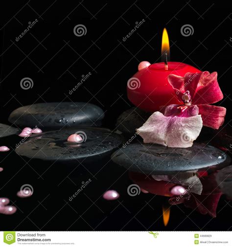 spa still life of red candle zen stones with drops orchid stock image image of candlelight
