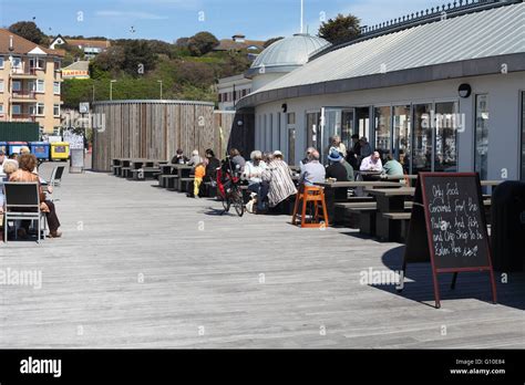 Visitors Enjoying Lunch Al Fresco On New Hastings Pier East Sussex UK Stock Photo Alamy