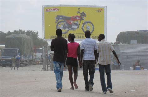A Commercial Sex Worker Walks With Youths In Oshikango Namibia On The Border Of Angola And