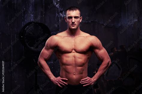 Muscular Sexy Shirtless Man Standing With Hands On Hips Stock Photo Adobe Stock