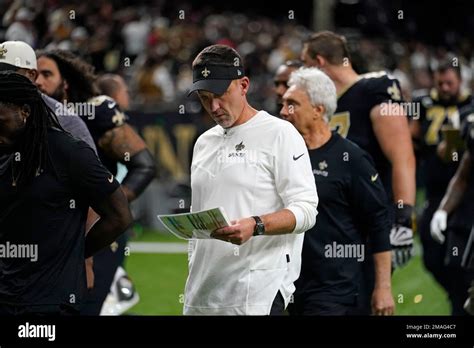 New Orleans Saints Head Coach Dennis Allen Walks Off The Field At The End Of The First Half Of
