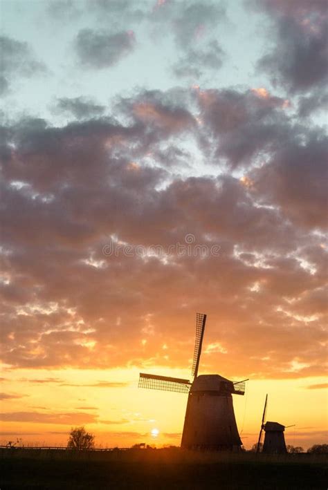 West Friesland Netherlands 2015 Two Windmills At Sunset On An Stock