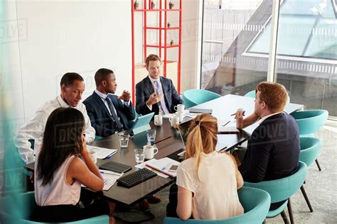 Work Colleagues Having A Meeting In Boardroom Stock Photo Dissolve