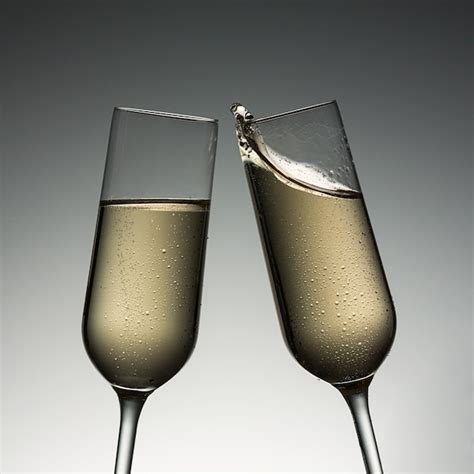 Premium Photo Clink Glasses With Champagne Splash