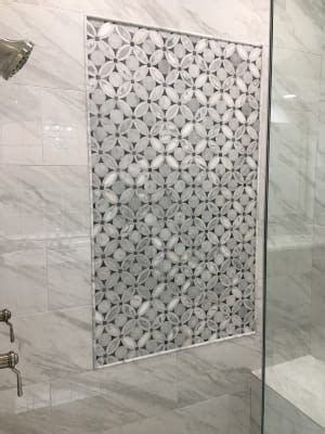 Design a gorgeous marble shower (on a budget!) i don't know why i was so indecisive for so long regarding the these were in the clearance section of our local tile store and costs a mere $3/sq foot!! Highland Blossom Marble Tile | Shower remodel, Shower remodel cost, Tiles