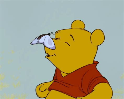 Winnie The Pooh Looking Up At Something With His Nose Covered By An