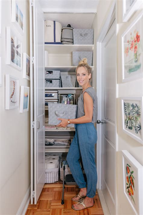 Km decor diy organizing open shelving in a bathroom boxes same type arranged facing different directions towels same color arranged differently. Storage Closet Organization & Bathroom Makeover | Katie's ...