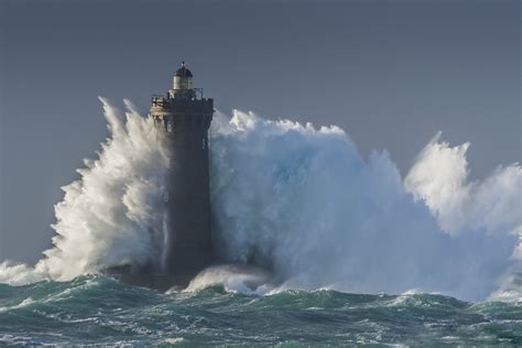 A Lighthouse Gets Pounded By Waves During A Storm Pics