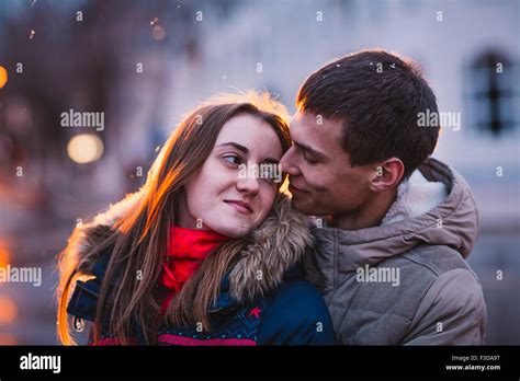 Portrait Of Young Beautiful Couple Kissing In An Autumn Rainy Day Love