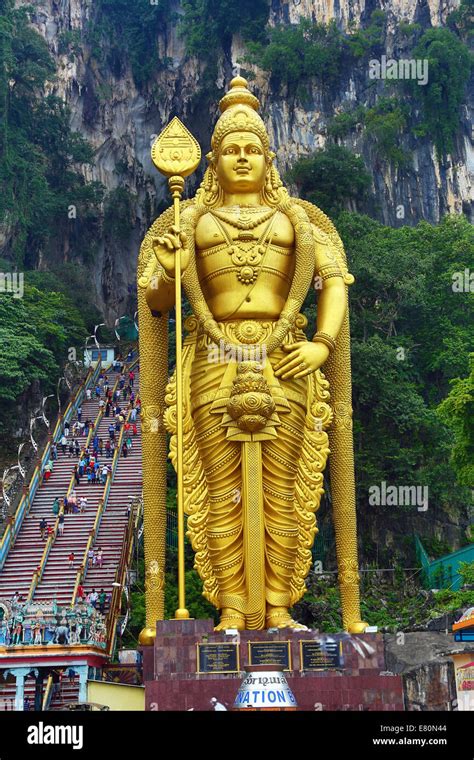 Giant Golden Statue Of The God Murugan At The Entrance Of The Batu