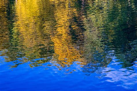 Image Of The Reflection Of Autumn Trees In The Water Stock Photo