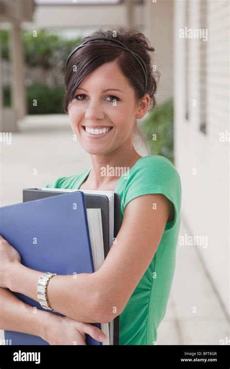 Portrait Of University Student Holding Books Stock Photo Alamy