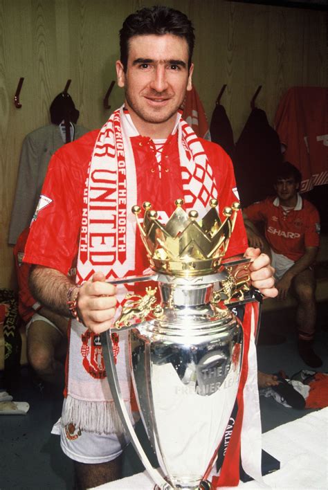 Eric Cantona Proudly Displays The Premier League Trophy After He Helped