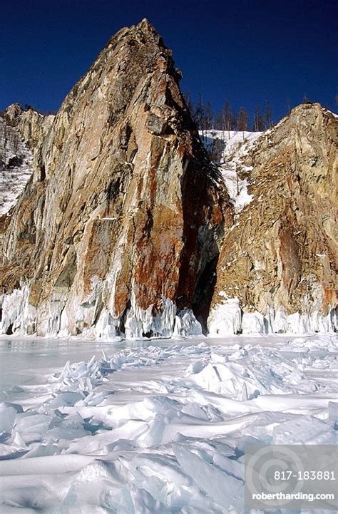 Granite Cliffs And Frozen Baikal Stock Photo