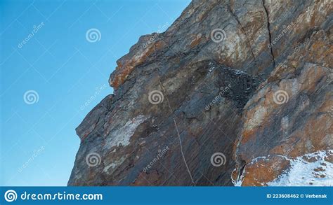 The Slope Of A Granite Rock Devoid Of Vegetation Against The