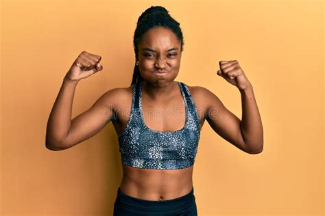 African American Woman With Braided Hair Wearing Sportswear Showing Arm