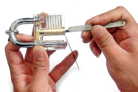 A lock pick and a torque wrench. Transparent Padlock Helps You Learn Basics Of Lock Picking