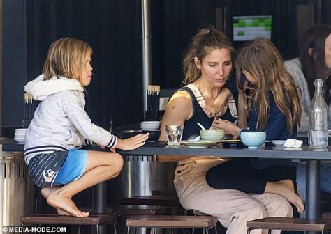 Elsa Pataky Flaunts Her Biceps In A Black Singlet As She Steps Out With Her Husband Chris