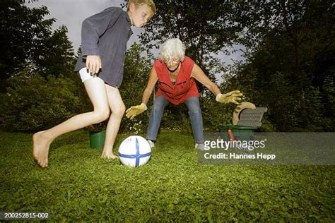 grandma playing football with grandson photos and premium high res pictures getty images